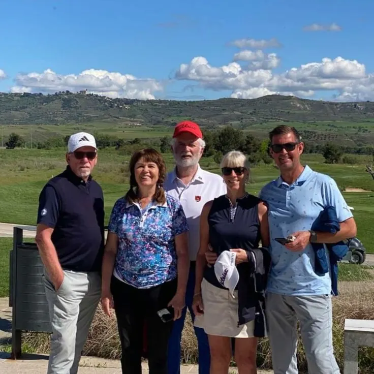 Baldur's group of five on a Spanish golf course with rolling hills behind them