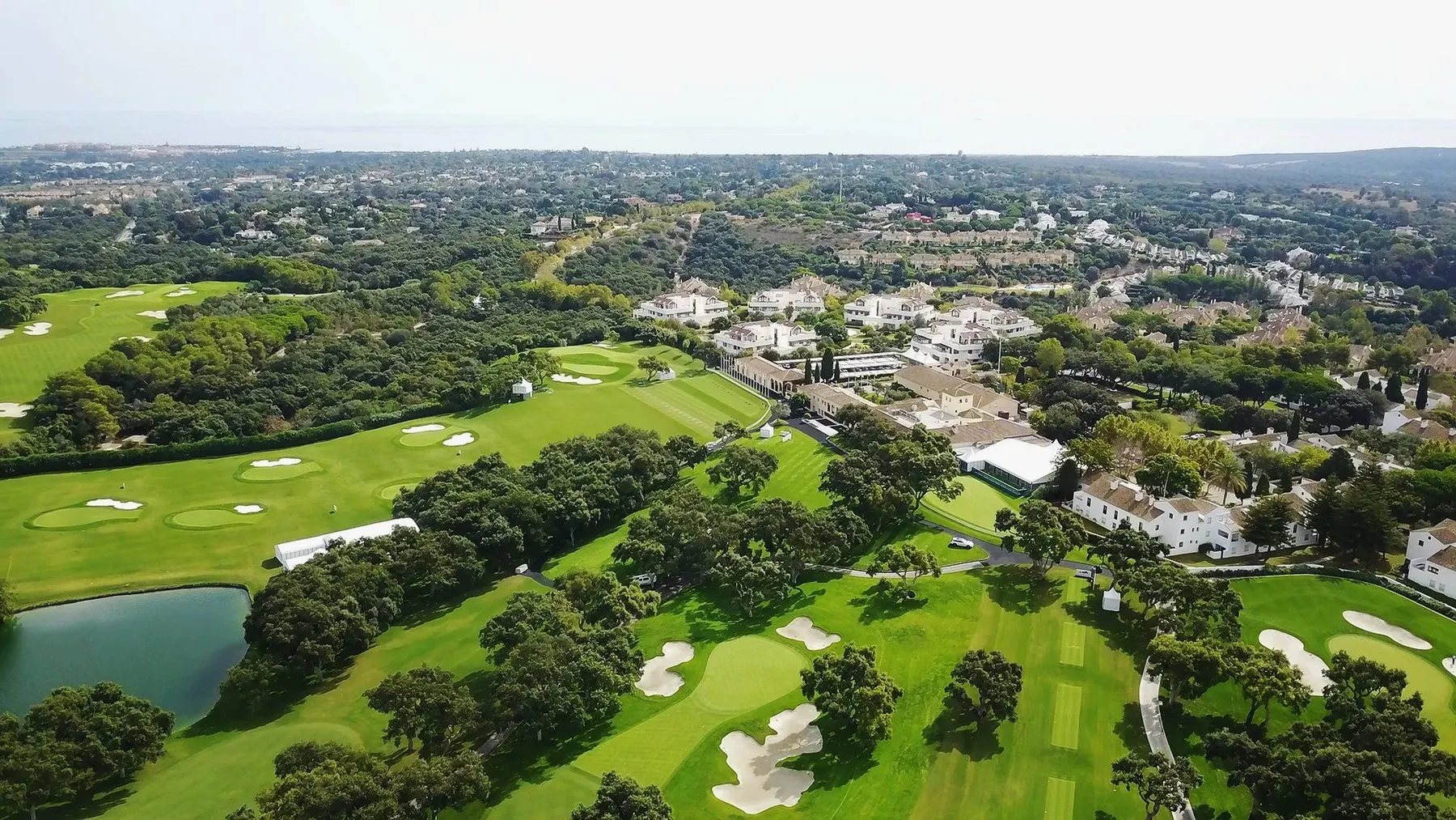Aerial view of Real Club Valderrama with its fairways, bunkers and lake on the Costa del Sol